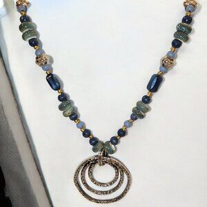 Blue Lagoon. Medium length chunky look. Knotted silk cord.  Blue/Sea green silve
